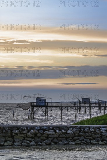 Sunset over Fishing huts over Randonnee entre Histoire et Nature, Fouras, Fouras-les-Bains,