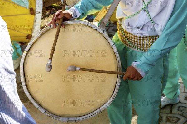 Musicians with their drums and colorful clothes at the typical religious festival of Congado in a