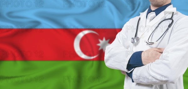 Azerbaijan healthcare concept. Male doctor on Azerbaijan flag. Doctor with crossed arms on