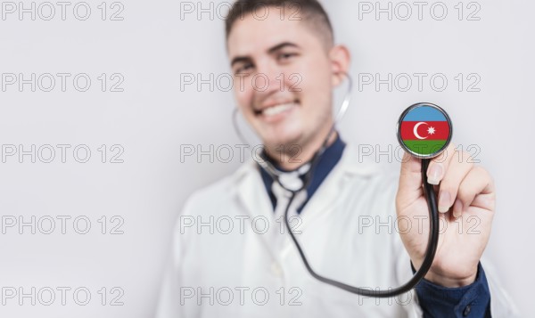 Doctor showing stethoscope with Azerbaijan flag. Azerbaijan national healthcare concept