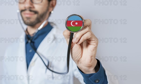 Doctor holding stethoscope with Azerbaijan flag. Azerbaijan health and care concept, Azerbaijan