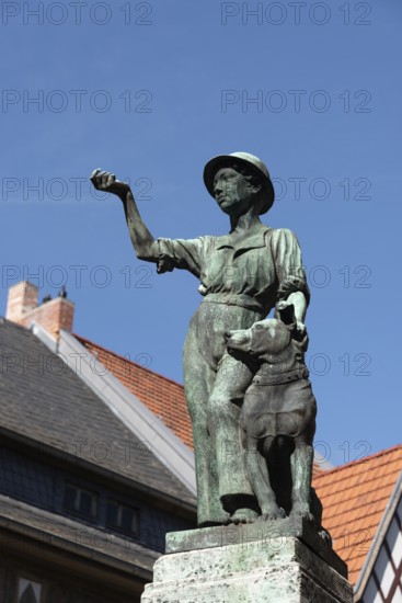 Symbolic statue of a young craftsman with a dog as a sign of civic freedom and loyalty in the World
