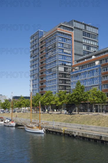 Modern office building and sailing boats at Germaniahafen, museum harbour, Kiel, Kiel Fjord, Baltic