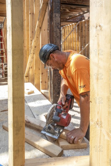 Detroit, Michigan - Jay Newcomb III helps rehab a long-vacant and crumbling commercial building in