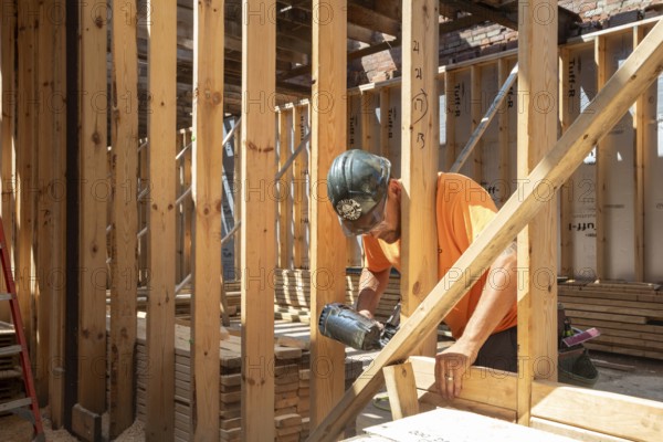 Detroit, Michigan - Jay Newcomb III helps rehab a long-vacant and crumbling commercial building in