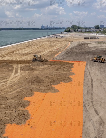 Detroit, Michigan - Workers spread clean dirt after old industrial contamination of cadmium,