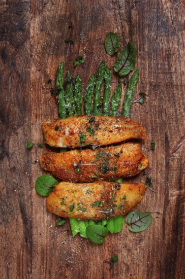 Fried fish fillet, tilapia with asparagus, homemade, no people