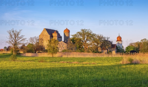 View over wildflower meadow at Sommersdorf Castle near Burgoberbach in the AltmÃ¼hl Valley in the