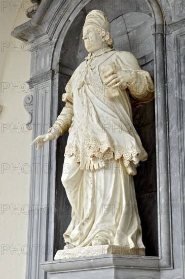 Marble statue of Pope Clement XI by sculptor F. Marattis from Padua in the portico of the
