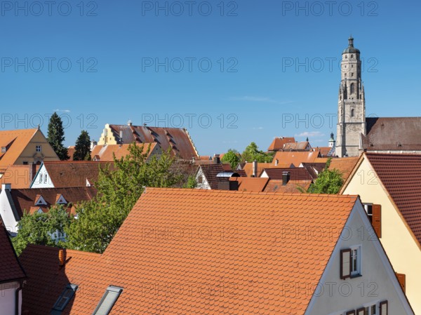 View from the medieval town wall over the houses of the historic old town to the tower of St