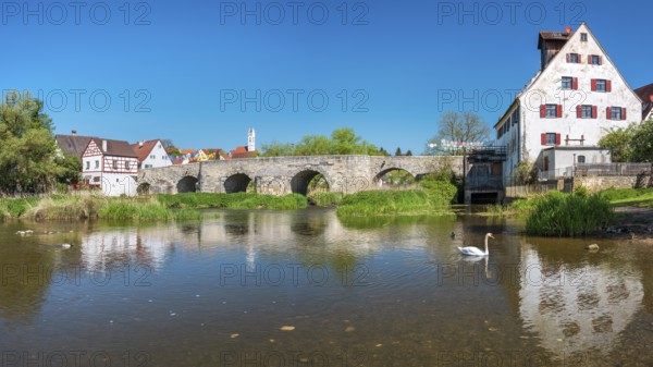 View over the river Wörnitz to the old town with the medieval stone bridge and the Herz Jesu