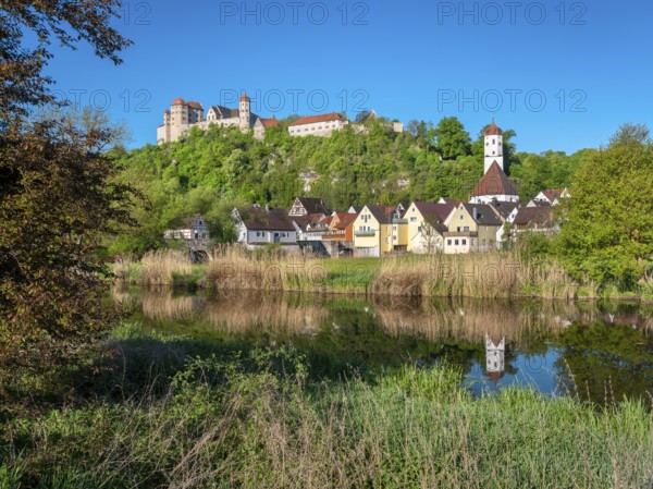 Castle and old town with St Barbara's Church reflected in the River Wörnitz, Harburg, Donau-Ries,