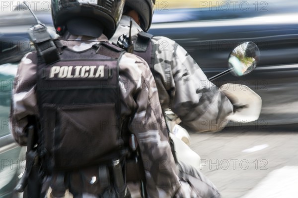 Policemen riding a motorcycle, Motion blur, City of Quito. Pichincha province, Ecuador, South