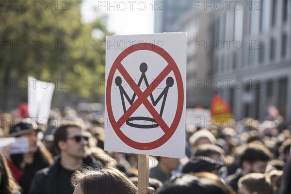 Close-up of protest sign with crossed-out crown. No kings Demonstration in progress. Generative AI,