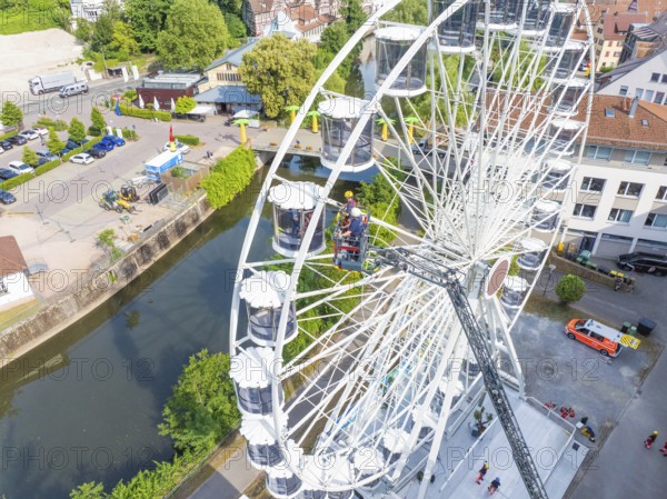 View from above of Ferris wheel and rescue operation in urban environment, fire brigade exercise