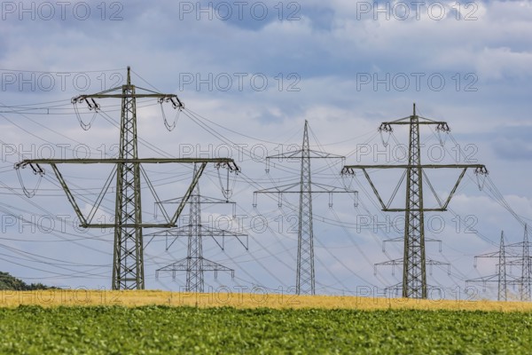 Many high-voltage power lines and lattice towers in the district of Ludwigsburg near Besigheim,
