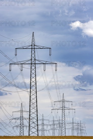 Many high-voltage power lines and lattice towers in the district of Ludwigsburg near Besigheim,