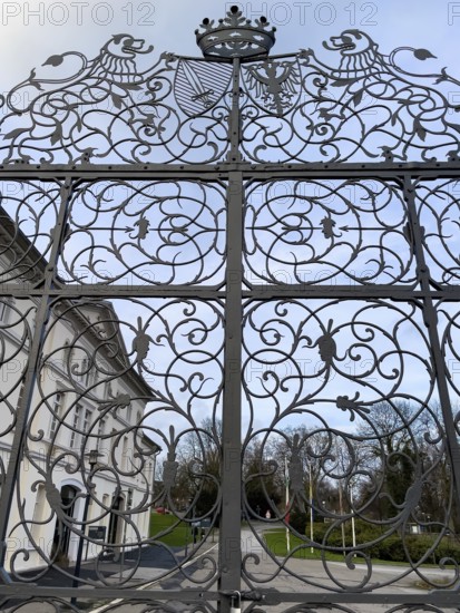 Wrought-iron Tor tor with ornaments and forged tendrils and stylised crown between Sclossgarten and