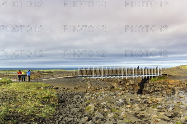 Metal lattice bridge over continental divide, Mid-Atlantic Ridge, volcanic landscape, Reykjanes