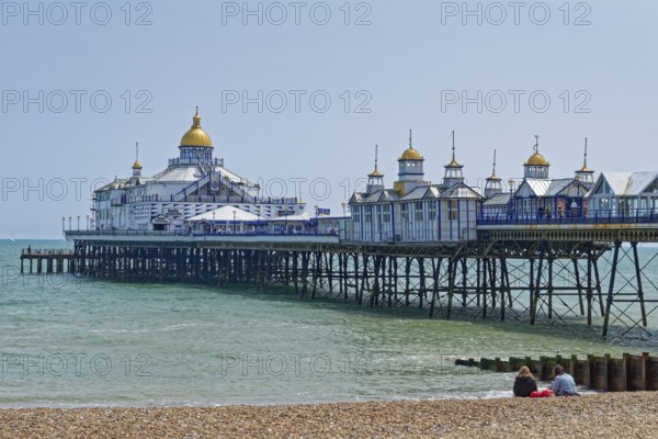 Beach and pier in Eastbourne, seaside resort on the English Channel, in the county of East Sussex,