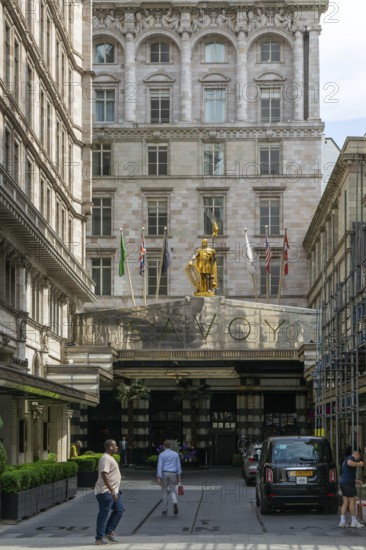 Count Peter of Savoy golden figure above entrance to The Savoy hotel, Strand, central London,