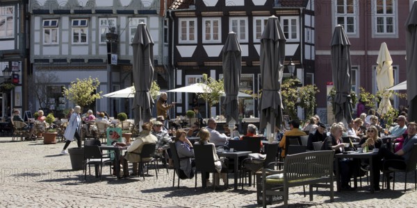 People in the outdoor catering area in the old town with many half-timbered houses, GroÃŸer Plan,