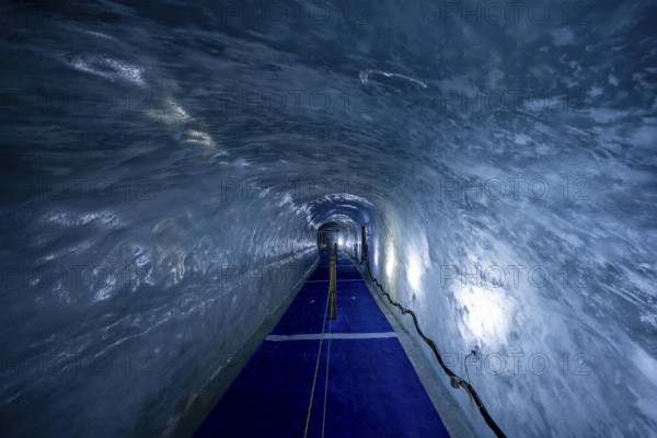 Artificial ice cave through the glacier ice, Mer de Glace, Montenvers, Chamonix, Haute-Savoie,