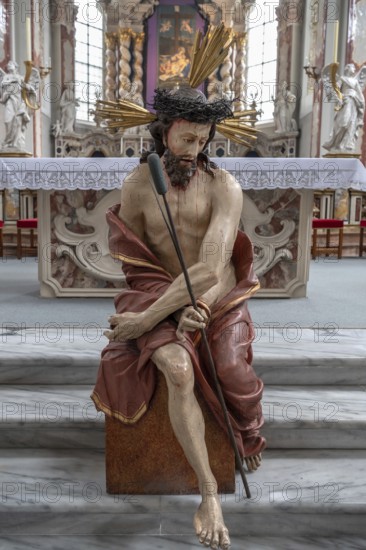 Large figure of Jesus in front of the altar of the collegiate basilica, Neustift St Margarethen,