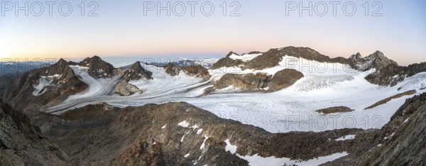 Mountain panorama, picturesque high mountain landscape at sunrise, glacier and rocky mountain