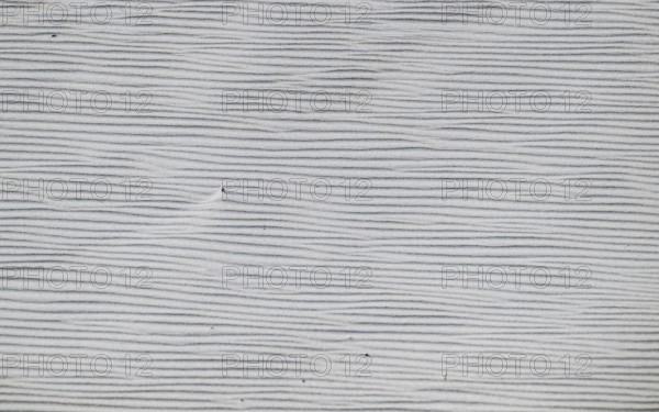 Close-up of a sandy area with fine, wavy lines in shades of grey, near Hvide Sande, North Sea,