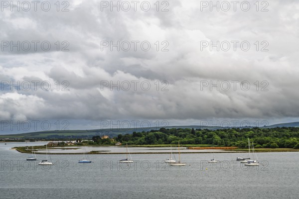 Yachts over Ramshorn Lake and Brownsea, Poole, Dorset, England, United Kingdom
