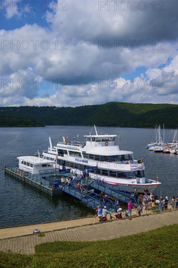 Passenger ship Stella Maris, with tourists at the landing stage, at the harbour, cloudy sky,