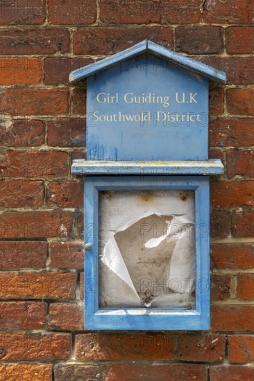 Girl Guides Guiding noticeboard derelict disused in ageing town short of children, Southwold,