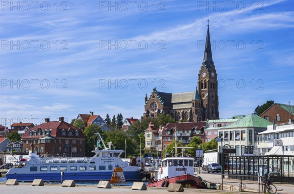 South harbour with house front and church, Lysekil, BohuslÃ¤n, VÃ¤stra Götalands lÃ¤n, Sweden,
