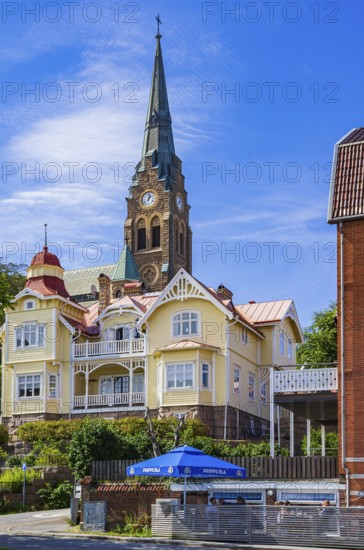 Church (Lysekils kyrka) and section of the house front at the south harbour, Lysekil, BohuslÃ¤n,