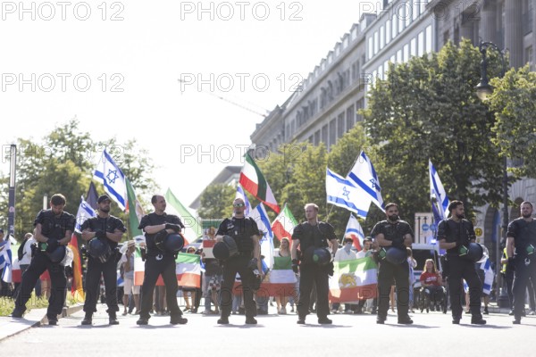 Police officers protect a pro-Israeli counter-protest with about 120 participants on the street
