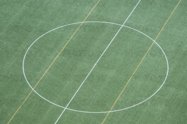 Bird's-eye view of soccer grass field with central circle, view from the tower of the Olympic