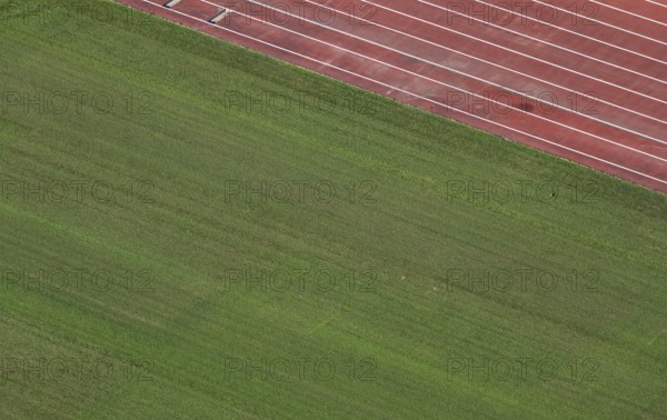 View of well-maintained stadium lawn and tartan track from the Olympic Stadium tower, Helsinki,