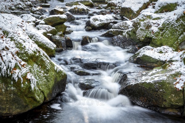 Lower Ilse Falls with snow and moss covered rocks in winter, Heinrich-Heine-Weg, Ilsetal, Harz