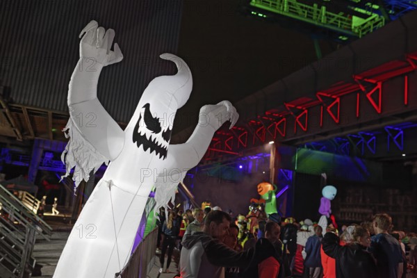 Illuminated ghost figure at Halloween Run, night run in the Dusiburg-Nord Landscape Park, Duisburg,