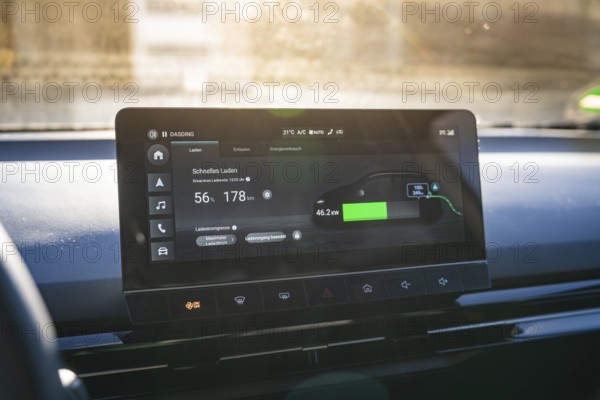 Electronic vehicle instrument shows fast charging information in modern interior, MG4 electric car,