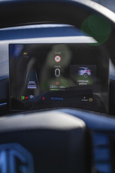 Electronic dashboard shows driving information and battery status in a modern car, MG4 electric