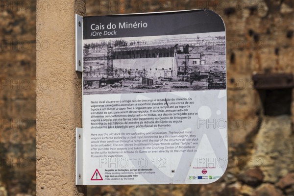 Explanatory board at the ruins of the former ore dock, Mina de Sao Domingos, historic copper