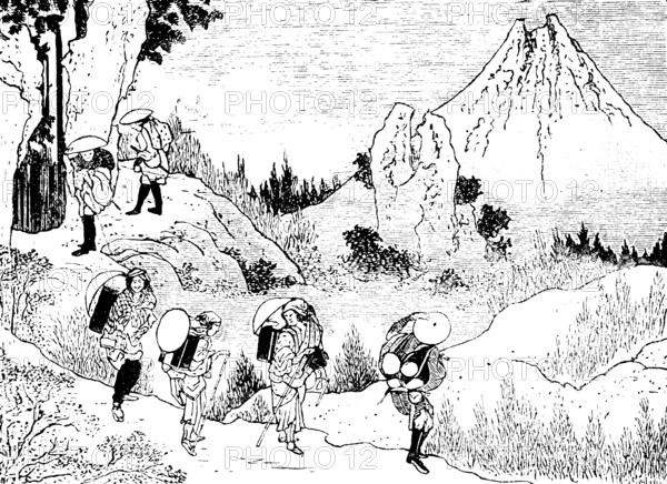 Japanese load carriers on a path in the mountains, stratovolcano, rocks, narrow path, arduous work,