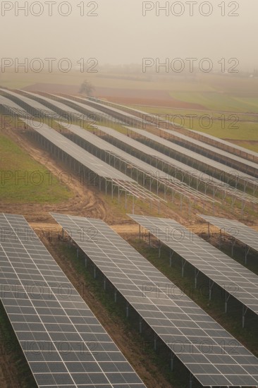 Extensive solar systems on green fields, clear lines and structures, energy revolution,