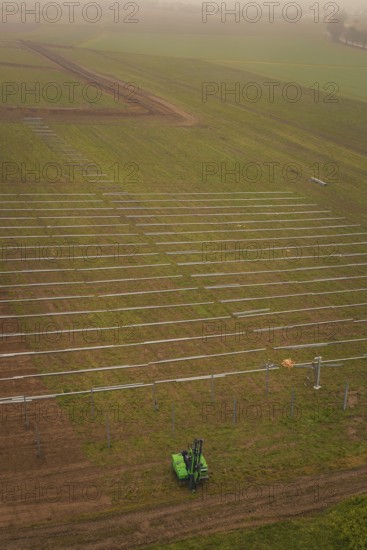 Prepared fields for solar plant construction, green environment, machine operation for
