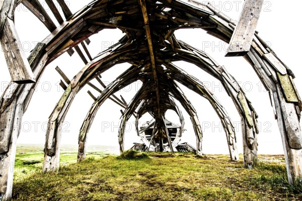 Interior view of an impressive outdoor wooden structure, sculpture by Drakkar Vardø. The