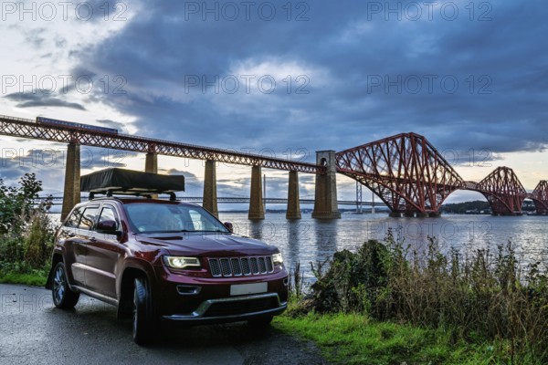 4x4 car trip with roof tent in Forth Bridge, Queensferry Crossing, Forth Estuary, Scotland, United
