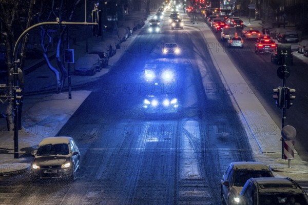 Ambulance, RTW, the Essen professional fire brigade during an emergency trip with flashing lights,