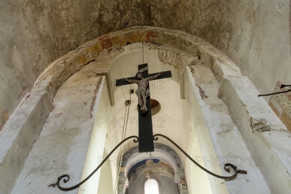 Maerier village. Low angle shows the architecture and crucifix hanging within the St Saturninus